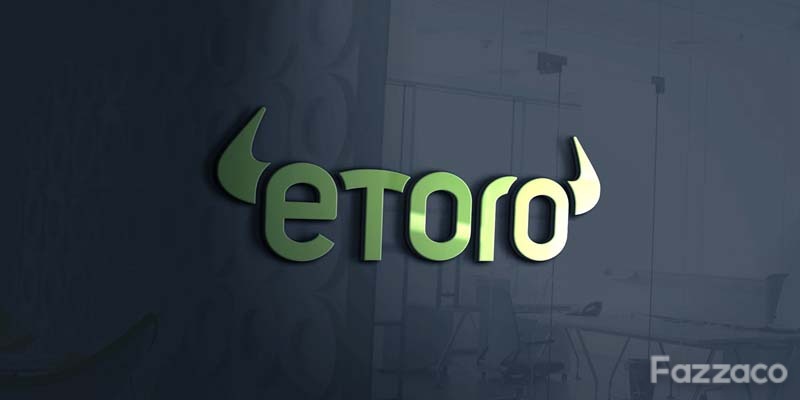 Investor using eToro Automated Trading tools on laptop.